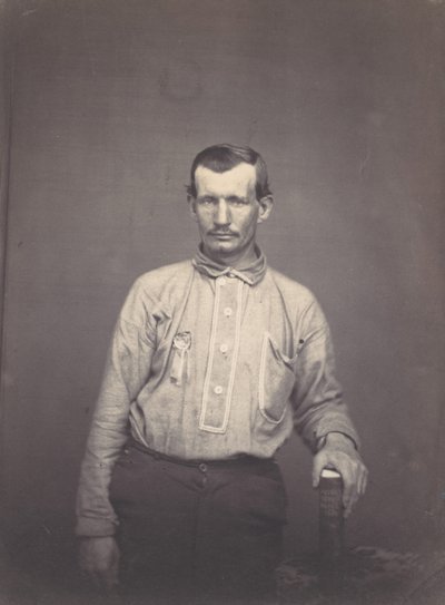 Férfi, aki szabadalmi hivatali könyvet tart, kb. 1857. alkotó: Oliver H. Willard.