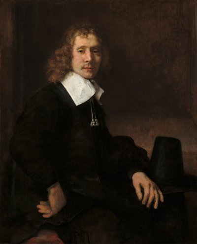 Egy fiatal férfi egy asztalnál ül (esetleg Govaert Flinck) alkotó: Rembrandt van Rijn