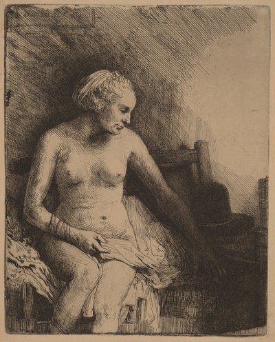 Fürdőző nő, mellette egy kalap alkotó: Rembrandt van Rijn