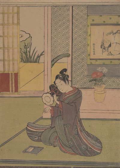 Fiatal férfi játszik egy noh-dobon. alkotó: Suzuki Harunobu