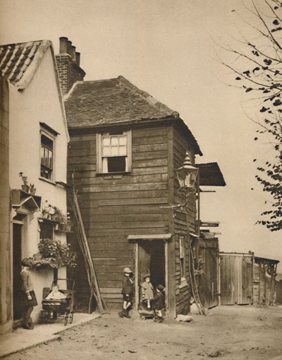 Régi házak Highgate-ben, amelynek bejárataiból a falusiak az autóbuszokat nézték, 1935. alkotó: Unbekannt