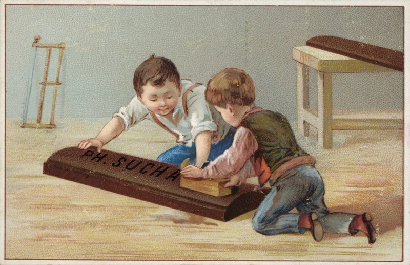 Gyerekek egy nagy, fából készült csokoládészeletet építenek, a Suchard Chocolate-t reklámozzák alkotó: French School