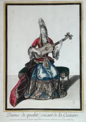 Lady játszik a gitáron