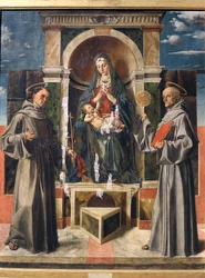 Madonna és gyermeke Szent Ferenc és Sienai Szent Bernardino között trónol, 1490 körül