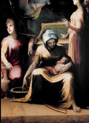 A Szűz születése. Részlet egy szolgálólánnyal és az újszülöttel. A művész életének évszámai: 1486-1551, 1540-1543 körül. Méret: 233x145 cm. Olaszország, Siena, Nemzeti Képtár (Siena, Pinacoteca Nazionale).