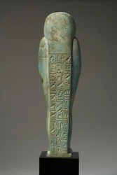 Egy usabti figura hátulnézete Hor-Khebi számára, késő dinasztia, késő 25.-kora 26. dinasztia, Kr.e. 700-600 körül (fajansz) (elölről lásd: 270353)