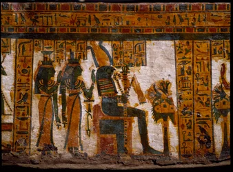 Egyiptomi ókor: az isteniták Ízisz és Neftisz Ozirist imádták. Az élet kulcsait egy kereszt ansee (Ankh) formájában tartják. Butehamon 21. dinasztia (Kr. e. 1085-935) írnok emberszabású szarkofágjának díszítése. Egyiptom Múzeum Torinóban (Tori