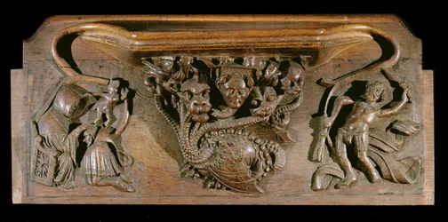 A hét halálos bűnt szimbolizáló, igényesen faragott hidrát ábrázoló nyomorúság, valósághű emberi fejjel, New College Chapel, Oxford, 14. század vége (fa)