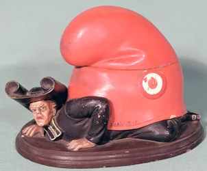Egy tintatartó vagy dohányfazék frígiai motorháztetővel összetört pap formájában, 1870 (kerámia)
