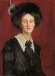 Hilda fekete kalapban