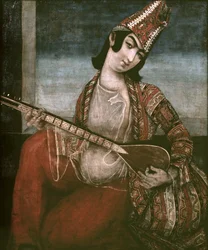 Fiatal nő gitározik