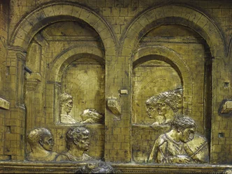 Heródes lakomája, a hátlap részlete, zenész és Salome, amint Keresztelő Szent János fejét hordozza tálcán. Jacopo della Quercia (1374-1438) által készített keresztelőmedence domborműve.