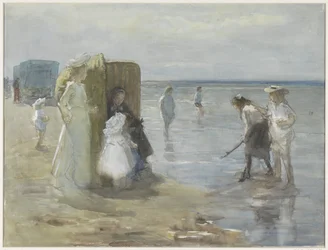 Kilátás a dagályvonal mentén a scheveningeni strandon, két hölgy és gyerek