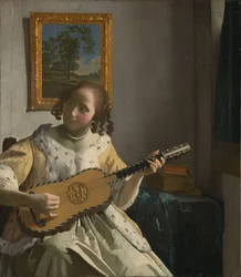 Fiatal nő gitározik.[1]
Alternatív cím(ek): "A gitáron játszó, gitározó lány":  

A gitáros.[2]