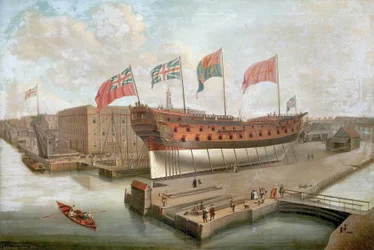"A HMS "Buckingham" a dokkokban, a deptfordi (Anglia) Királyi Hajógyár fő raktára előtt.