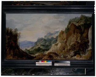 Panorámás hegyvidéki táj szegényeknek adó utazókkal, azon túl teherhordó lovakkal