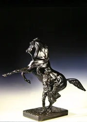 A nevelő telivér és a lovász (bronz)