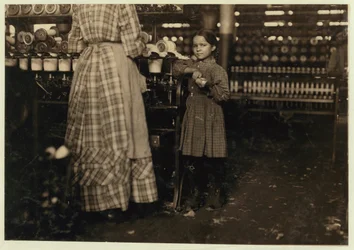 Fannie, 48 inches high, aged 7, one of 19 children helping her sister in Elk Mills, Fayetteville, Tennessee, 1910 