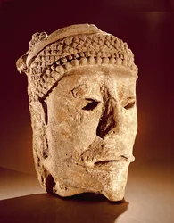 Head cut from a wall at Comalcalco, Tabasco, Classic Maya (stucco)