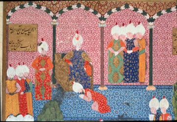 I. Szulejmán, a Nagyszerű (1494-1566) portréja, oszmán szultán, udvarától körülvéve a trónra lépés szertartásán. Részlet. Arifi Szulejmánnáme című művéből származó miniatúra (H.1517 kézirat), 1558. Topkapi Sarayi, Isztambul